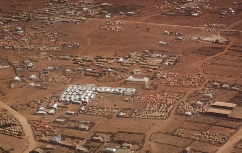 An aerial view of camps for internally displaced persons (IDPs) in Baidoa, Somalia, on February 15, 2022. Insufficient rainfall since late 2020 has come as a fatal blow to populations already suffering from a locust invasion between 2019 and 2021, the Covid-19 pandemic. For several weeks, humanitarian organizations have multiplied alerts on the situation in the Horn of Africa, which raises fears of a tragedy similar to that of 2011, the last famine that killed 260,000 people in Somalia. Desperate, hungry and thirsty, more and more people are flocking to Baidoa from rural areas of southern Somalia, one of the regions hardest hit by the drought that is engulfing the Horn of Africa. (Photo by YASUYOSHI CHIBA / AFP)