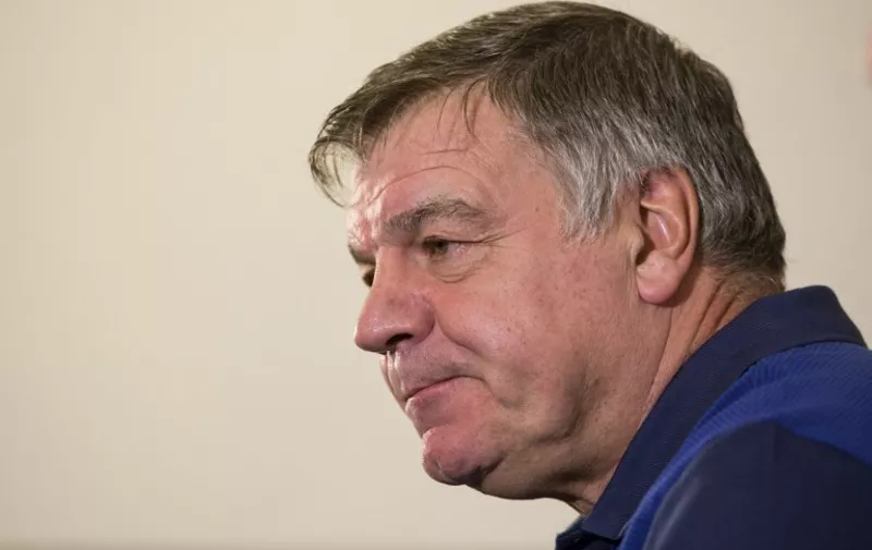 (FILES) This file photo taken on August 29, 2016 shows England football manager Sam Allardyce taking part in a press conference at St George's Park, near Burton-on-Trent, central England.

England manager Sam Allardyce has been secretly filmed giving advice on how to circumnavigate transfer rules and mocking his predecessor Roy Hodgson's voice, the Daily Telegraph reported on September 27, 2016. / AFP PHOTO / OLI SCARFF