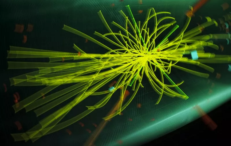 A graphic showing traces of collision of particles at the Compact Muon Solenoid (CMS) experience is pictured with a slow speed experience at Universe of Particles exhibition of the the European Organization for Nuclear Research (CERN) on December 13, 2011 in Geneva. Scientists at the CERN believe they have identified the location of the Higgs boson, a elusive subatomic particle that is thought to be a basic building block of the universe.  AFP PHOTO / FABRICE COFFRINI (Photo by FABRICE COFFRINI / AFP)