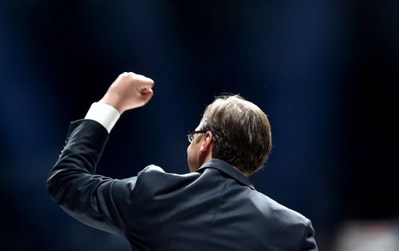 Serbian Prime Minister Aleksandar Vucic and leader of the Serbian Progressive Party (SNS) gestures during a political rally at the Kombank Arena in Belgrade on April 21, 2016 ahead of the April 24 general election. 
Vucic, who is bidding for another four years in power, is a former ultra-nationalist and close ally of Slobodan Milosevic remade as a pro-European liberal. In a political transformation viewed by critics as pragmatic rather than ideological, the tall 46-year-old Vucic now leads Serbia's efforts to join the European Union.   / AFP PHOTO / ANDREJ ISAKOVIC