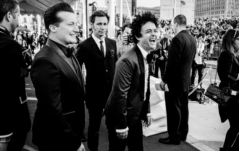 CLEVELAND, OH - APRIL 18: (EDITORS NOTE: This images was processed using digital filters) (L-R) Drummer Tré Cool , bass player Mike Dirnt, and singer Billie Joe Armstrong of the band Green Day attend the 30th Annual Rock And Roll Hall Of Fame Induction Ceremony at Public Hall on April 18, 2015 in Cleveland, Ohio.   Mike Coppola/Getty Images/AFP