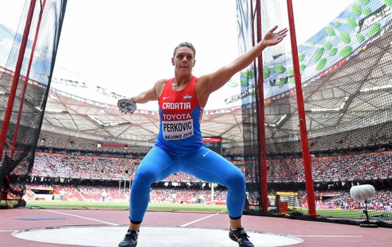 Croatia's Sandra Perkovic competes in the qualifying round of the women's discus throw athletics event at the 2015 IAAF World Championships at the "Bird's Nest" National Stadium in Beijing on August 24, 2015.  AFP PHOTO / FRANCK FIFE
