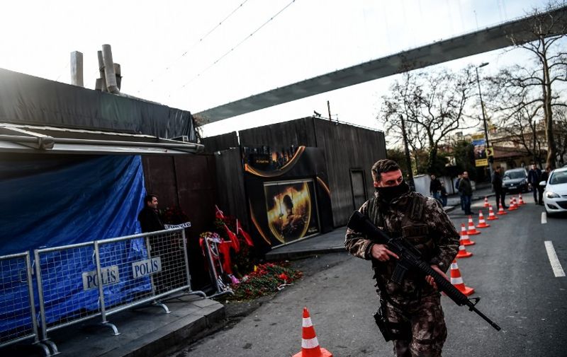 A Turkish special force police officer walks in front of the Reina nightclub on January 4, 2017 in Istanbul, three days after a gunman killed 39 people on New Year's night.  
The gunman had fought in Syria for Islamic State jihadists, a report said on January 3, as Turkish authorities intensified their hunt for the attacker. Of the 39 dead, 27 were foreigners, mainly from Arab countries, with coffins repatriated overnight to countries including Lebanon and Saudi Arabia. / AFP PHOTO / OZAN KOSE