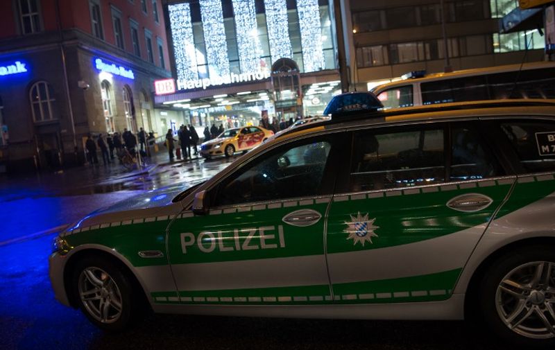 Police car is pictured outside the Munich train station on December 31, 2015. 
German police said Thursday that they had "indications that a terror attack" was being planned for New Year's Eve in the southern city of Munich, as they called on the public to avoid large gatherings and two key train stations. / AFP / dpa / Sven Hoppe / Germany OUT