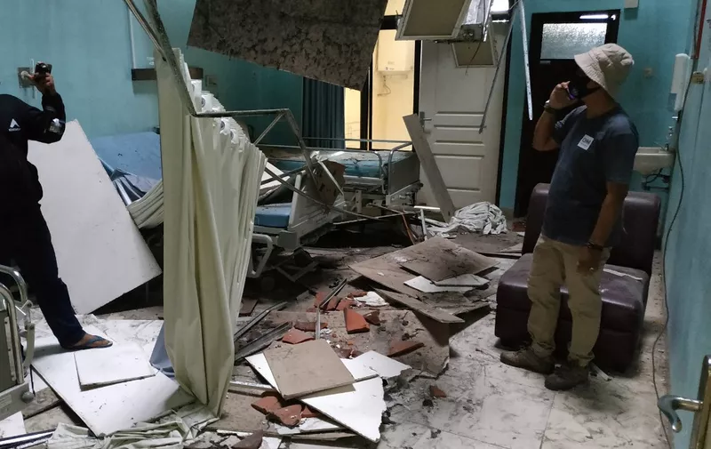 Damage to a ward is seen at the Ngudi Waluyo hospital in Blitar, East Java, on April 10, 2021, after a 6.0 magnitude earthquake struck off the coast of Indonesia's Java island. (Photo by AVIAN / AFP)
