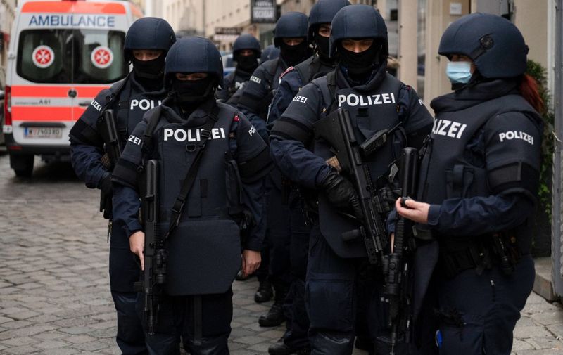 Armed police officers stand guard before the arrival of Austrian Chancellor Kurz and President of the European Council to pay respects to the victims of the recent terrorist attack in Vienna, Austria on November 9,2020. (Photo by JOE KLAMAR / AFP)