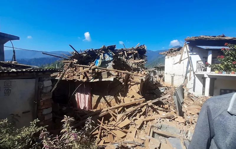 Damaged houses lie in ruins, in the aftermath of an earthquake at Pipaldanda village of Jajarkot district on November 4, 2023. At least 132 people were killed in an overnight earthquake that struck a remote pocket of Nepal, officials said on November 4, as security forces rushed to assist with rescue efforts. (Photo by Balkumar Sharma / AFP)
