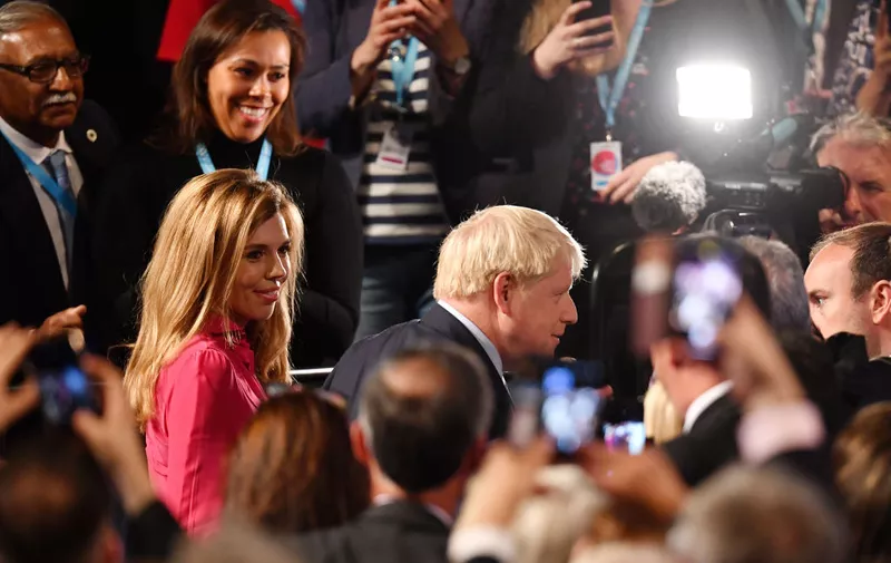 MANCHESTER, ENGLAND - OCTOBER 02: Prime Minister Boris Johnson leaves with his girlfriend Carrie Symonds following his keynote speech on day four of the 2019 Conservative Party Conference at Manchester Central on October 2, 2019 in Manchester, England. The U.K. government prepares to formally submit its finalised Brexit plan to the EU today. The offer replaces the Northern Irish Backstop with border, customs and regulatory checks lasting until 2025. (Photo by Jeff J Mitchell/Getty Images)