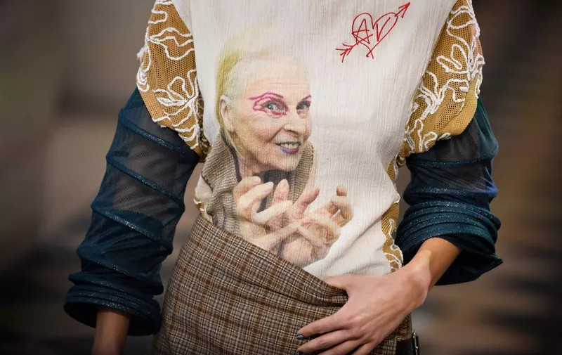 A model presents a creation with the face of the late fashion designer Vivienne Westwood during Vivienne Westwood Womenswear Fall-Winter 2023-2024 collection during Paris Fashion Week at the Hotel de la Marine, on Place de la Concorde  in Paris, on March 4, 2023. (Photo by JULIEN DE ROSA / AFP)