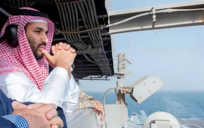 A handout picture released on July 8, 2015 by the Saudi Press Agency (SPA) shows Saudi deputy Crown Prince and Minister of Defence Mohammed bin Salman looking at the flight deck during a visit to the USS aircraft carrier Theodore Roosevelt which is operating in Gulf waters. Salman's visit comes as Sunni-dominated Saudi Arabia and other Gulf states worry that Washington, their traditional defence partner in the region, is not taking seriously enough their concerns about what they consider Shiite Iran's "destabilising acts" in the Middle East. AFP PHOTO / HO / SPA
=== RESTRICTED TO EDITORIAL USE - MANDATORY CREDIT "AFP PHOTO / HO / SPA" - NO MARKETING NO ADVERTISING CAMPAIGNS - DISTRIBUTED AS A SERVICE TO CLIENTS === / AFP / SPA / -