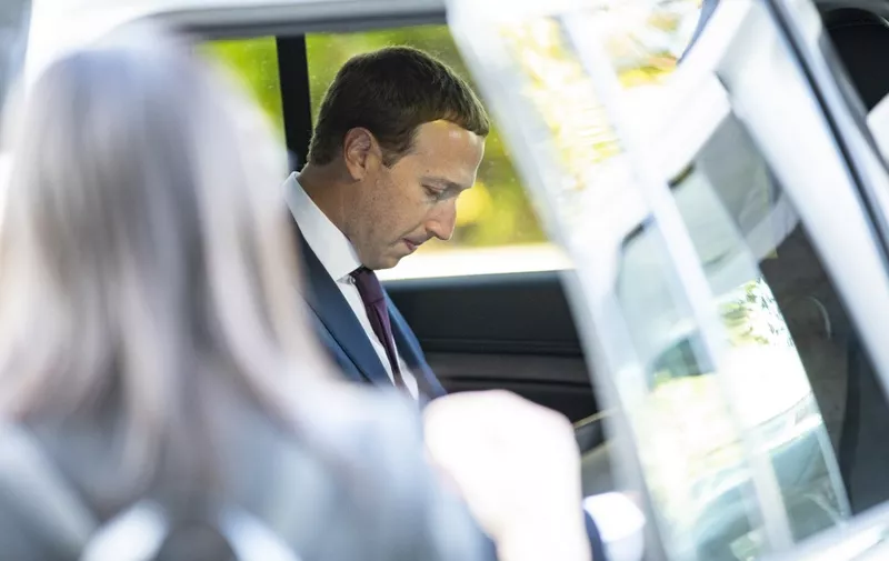 WASHINGTON, DC - SEPTEMBER 19: Facebook founder and CEO Mark Zuckerberg eats some food that was waiting for him in his vehicle after leaving a meeting with Senator John Cornyn (R-TX) in his office on Capitol Hill on September 19, 2019 in Washington, DC. Zuckerberg is making the rounds with various lawmakers in Washington today.   Samuel Corum/Getty Images/AFP