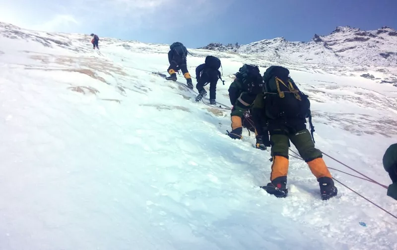 In this photograph taken on May 9, 2016, mountaineers walk from Camp 3 to Camp 4, as they pushing for the summit of Mount Everest. An Indian mountaineer has died on Mount Everest and two of his teammates are missing, expedition organisers said May 23, 2016, as the death toll from the Himalayan climbing season rose to five. Subhash Pal reached the 8,848-metre (29,029-foot) summit on May 21, but collapsed while descending the Hillary Step ice wall and died the following day. He was the third to die on Everest in recent days, after an Australian and a Dutch climber succumbed to altitude sickness. Another two climbers have died on other peaks. (Photo by NIMA GYALZEN SHERPA / AFP)