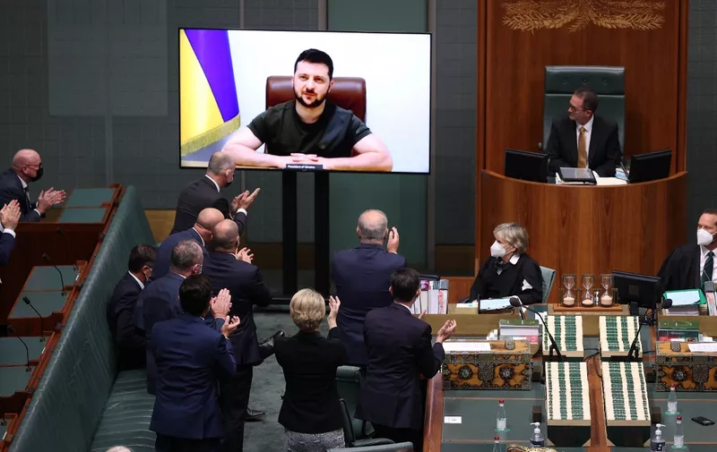 Ukrainian President Volodymyr Zelenskyy (on screen) addresses the Australian Parliament in the House of Representatives chamber via a video link in Canberra on March 31, 2022. (Photo by STRINGER / AFP)