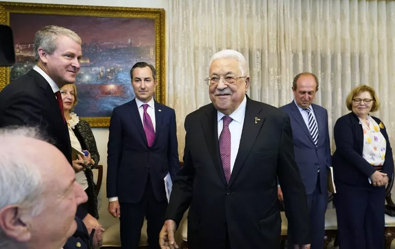 Palestinian president Mahmud Abbas  (C) arrives for a meeting with US Secretary of State Antony Blinken in Amman on October 13, 2023. Blinken spent October 12 in Tel Aviv where he promised unwavering solidarity to US ally Israel after the surprise October 7 offensive by Hamas, who killed over 1,200 people and took about 150 more hostage. Israel has killed more than 1,400 people in strikes in the Gaza Strip since the Hamas attack and has cut off food, water and electricity. (Photo by Jacquelyn Martin / POOL / AFP)