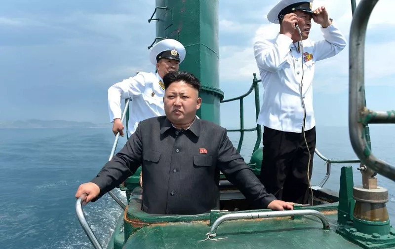 This undated picture released from North Korea's official Korean Central News Agency (KCNA) on June 16, 2014 shows North Korean leader Kim Jong-Un (C) inspecting the submarine No. 748 of Korean People's Army (KPA) naval unit 167 led 7th regiment at an undisclosed location in North Korea. 