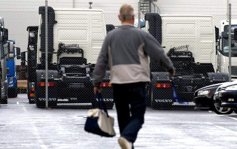An employee leaves the Volvo AB truck plant in Tuve outside Gothenburg on September 30, 2008. Swedish truck and bus maker Volvo AB announced plans Tuesday to lay off around 1,400 workers at truck plants in Belgium and Sweden because of falling demand in Europe. The company said 400 jobs will go at a plant in Ghent, Belgium, and 980 at two Swedish plants in Gothenburg and Umea. Talks with unions would start ``immediately,'' it said. 
AFP PHOTO: Bjorn Larsson Rosvall / AFP PHOTO / SCANPIX SWEDEN / BJORN LARSSON ROSVALL