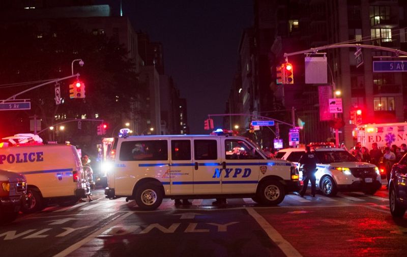 Police block off road near the site of an alleged bomb explosion on West 23rd Street on September 17, 2016, in New York.
An explosion in New York's upscale and bustling Chelsea neighborhood injured at least 25 people, none of them in a life-threatening condition, late Saturday, the fire department said. / AFP PHOTO / Bryan R. Smith