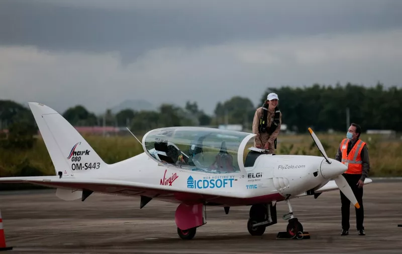 British-Belgian pilot Zara Rutherford, 19, steps out of her Shark ultralight aircraft, upon her arrival at Tocumen International Airport in Panama City, on September 6, 2021. - Rutherford aims to be youngest woman to circle the globe solo. (Photo by ROGELIO FIGUEROA / AFP) / The erroneous mention[s] appearing in the metadata of this photo by ROGELIO FIGUEROA has been modified in AFP systems in the following manner: [September] instead of [August]. Please immediately remove the erroneous mention[s] from all your online services and delete it (them) from your servers. If you have been authorized by AFP to distribute it (them) to third parties, please ensure that the same actions are carried out by them. Failure to promptly comply with these instructions will entail liability on your part for any continued or post notification usage. Therefore we thank you very much for all your attention and prompt action. We are sorry for the inconvenience this notification may cause and remain at your disposal for any further information you may require.