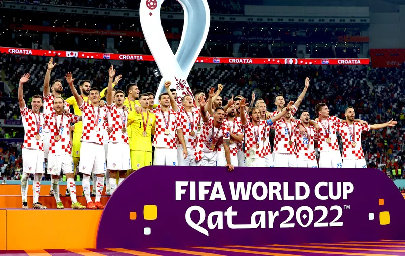 Soccer Football - FIFA World Cup Qatar 2022 - Third-Place Playoff - Croatia v Morocco - Khalifa International Stadium, Doha, Qatar - December 17, 2022
Croatia players celebrate with their medals on stage as they finish in third place REUTERS/Lee Smith