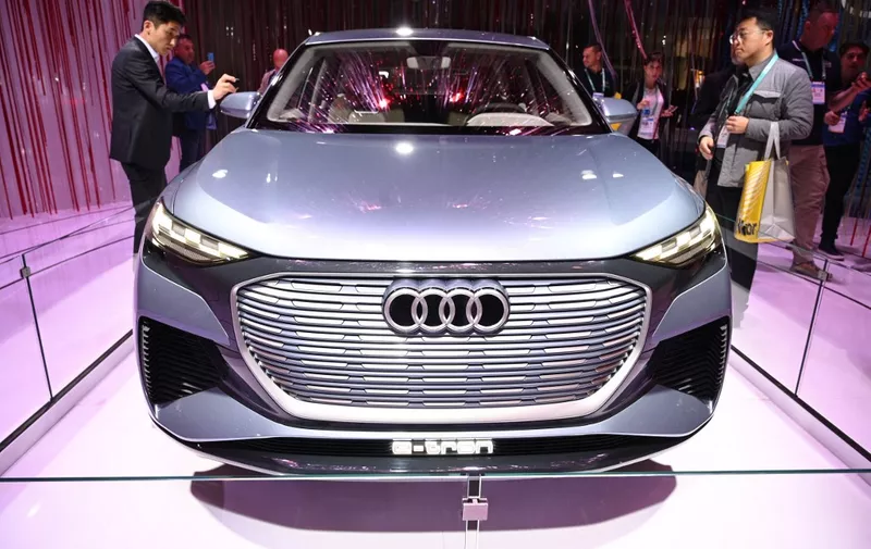 Attendees view the Audi Q4 Etron concept car, January 7, 2020 at the 2020 Consumer Electronics Show (CES) in Las Vegas, Nevada. (Photo by Robyn Beck / AFP)