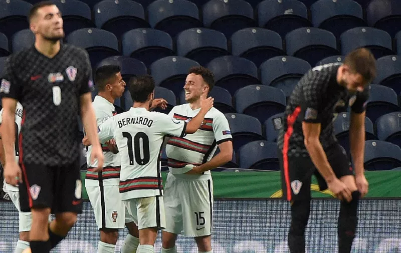 Portugal's forward Diogo Jota (C-R) celebrates with teammates after scoring a goal during the UEFA Nations League A group 3 football match between Portugal and Croatia at the Dragao Stadium in Porto on September 5, 2020. (Photo by MIGUEL RIOPA / AFP)