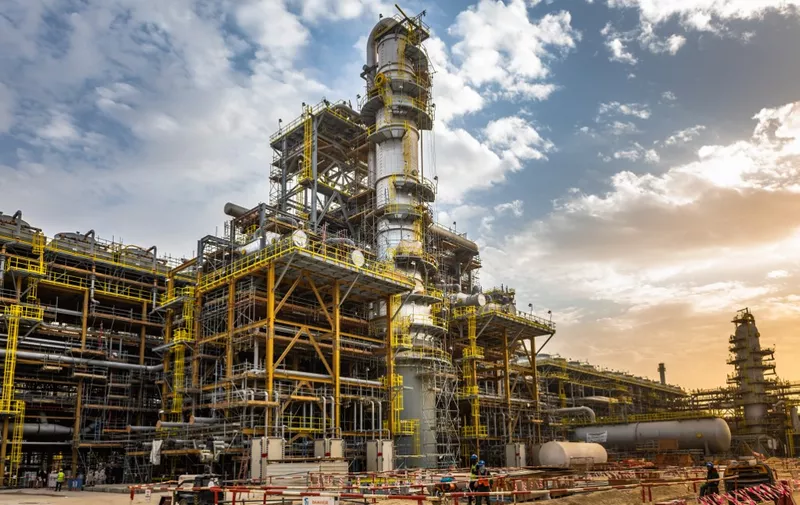 A handout picture provided by Energy giant Saudi Aramco, Saudi Arabia's Oil Company, shows its Fadhili Gas Plant Project, located 30 km west of the city of Jubail in the eastern province of Saudi Arabia on January 16, 2019. - Aramco posted on May 12, 2020 a 25 percent slump in first-quarter profit and said the coronavirus crisis which triggered a crash in oil prices would weigh heavily on demand in the year ahead. (Photo by Mohamed ALEBN ALSHAIKH / Saudi Aramco / AFP) / === RESTRICTED TO EDITORIAL USE - MANDATORY CREDIT "AFP PHOTO / HO /ARAMCO" - NO MARKETING NO ADVERTISING CAMPAIGNS - DISTRIBUTED AS A SERVICE TO CLIENTS ===