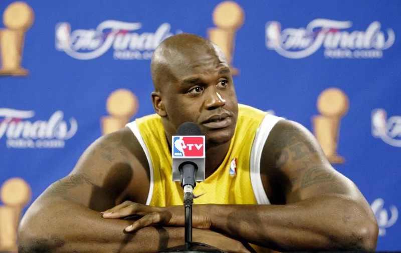 Shaquille O'Neal of the Los Angeles Lakers answers question before practice for game five of the NBA Finals against the Detroit Pistons 14 June 2004 at The Palace in Auburn Hills, MI. The Pistons lead the best-of-seven game series 3-1.      AFP PHOTO/Jeff HAYNES / AFP / JEFF HAYNES