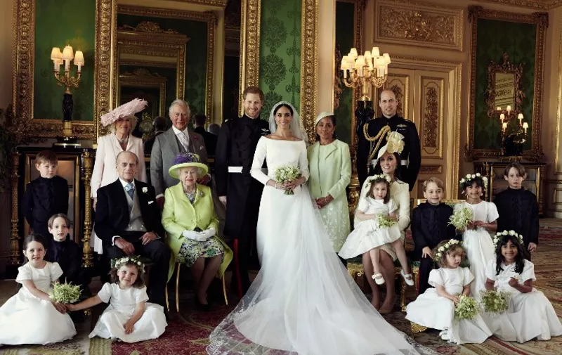 A picture released by Kensington Palace on behalf of The Duke and Duchess of Sussex on May 21, 2018 shows Britain's Prince Harry, Duke of Sussex, (CL) and his wife Meghan, Duchess of Sussex, (CR) posing for an official wedding photograph with (L-R back row) Britain's Camilla, Duchess of Cornwall, Britain's Prince Charles, Prince of Wales, Doria Ragland, the Duchess of Sussex's mother, Britain's Prince William, Duke of Cambridge, (middle row L-R): Master Jasper Dyer, Britain's Prince Philip, Duke of Edinburgh, Britain's Queen Elizabeth II, Britain's Catherine, Duchess of Cambridge, Princess Charlotte of Cambridge, Prince George of Cambridge, Miss Rylan Litt, Master John Mulroney and (front row) Miss Ivy Mulroney, Master Brian Mulroney, Miss Florence van Cutsem, Miss Zalie Warren and Miss Remi Litt in the Green Drawing Room, Windsor Castle, in Windsor on May 19, 2018.  / AFP PHOTO / KENSINGTON PALACE / Alexi Lubomirski / RESTRICTED TO EDITORIAL USE - MANDATORY CREDIT "AFP PHOTO / THE DUKE AND DUCHESS OF SUSSEX / ALEXI LUBOMIRSKI " - NO MARKETING NO ADVERTISING CAMPAIGNS - NO COMMERCIAL USE - NO SALES - RESTRICTED TO SUBSCRIPTION USE - NO USE IN SOUVENIRS OR MEMORABILIA - NO CROPPING, ENHANCING OR DIGITAL MODIFICATION - NOT TO BE USED AFTER DECEMBER 31, 2018 - DISTRIBUTED AS A SERVICE TO CLIENTS

 / The erroneous mention[s] appearing in the metadata of this photo by Alexi Lubomirski has been modified in AFP systems in the following manner: [A picture released by Kensington Palace on behalf of The Duke and Duchess of Sussex on May 21, 2018 shows Britain's Prince Harry, Duke of Sussex, (CL) and his wife Meghan, Duchess of Sussex, (CR) posing for an official wedding photograph with (L-R back row) Britain's Camilla, Duchess of Cornwall, Britain's Prince Charles, Prince of Wales, Doria Ragland, the Duchess of Sussex's mother, Britain's Prince William, Duke of Cambridge, (middle row L-R): Master Jasper Dyer, Britain's Prince Philip, Duke of Edinburgh, Britain's Queen Elizab