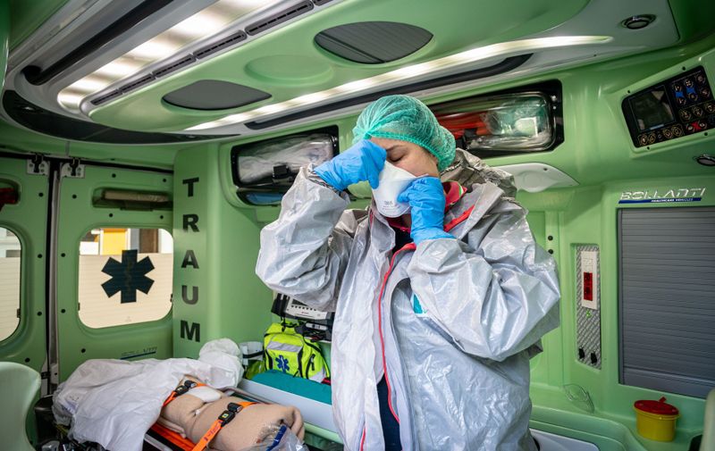 Transfer of a suspected COVID-19 positive patient between two hospitals aboard an Ital Enferm ambulance. Sara, the operator, wears the security aids
Coronavirus Emergency - Transfer of a COVID-19 patient by ambulance, Milan, Italy - 03 Apr 2020, Image: 511908947, License: Rights-managed, Restrictions: , Model Release: no, Credit line: Marco Passaro / Shutterstock Editorial / Profimedia