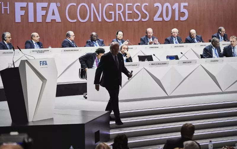 A photo taken on May 29, 2015 shows FIFA President Sepp Blatter leaving the stage during the 65th FIFA Congress in Zurich. Blatter on June 2, 2015 resigned as president of FIFA as a mounting corruption scandal engulfed world football's governing body. The 79-year-old Swiss official, FIFA president for 17 years and only reelected on May 29, said a special congress would be called as soon as possible to elect a successor.  AFP PHOTO / MICHAEL BUHOLZER