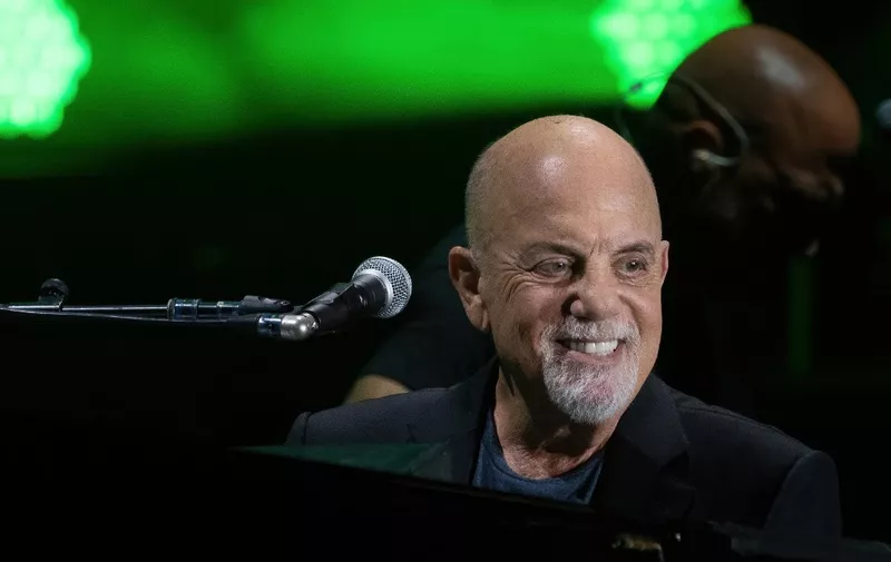 (FILES) US musician Billy Joel performs during a concert at the Formula One Grand Prix at Circuit of the Americas in Austin, Texas on October 23, 2021. All eyes are on -- who else? -- Taylor Swift ahead of Sunday's Grammys, when the megastar could break the record for most Album of the Year wins at a gala where women finally are taking center stage. (Photo by SUZANNE CORDEIRO / AFP)