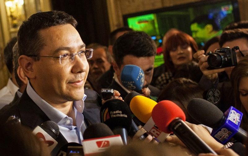 Romanian Prime Minister and presidential candidate Victor Ponta addresses the media to concede defeat after the exit polls placed him second, on November 16, 2014, in Bucharest. Ponta conceded defeat in a presidential runoff he had been widely expected to win, after early exit polls showed he was neck-and-neck with his conservative opponent Klaus Iohannis. AFP PHOTO / ANDREI PUNGOVSCHI