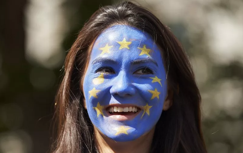 A woman with her face painted as a European flag is pictured as thousands of protesters take part in a March for Europe, through the centre of London on July 2, 2016, to protest against Britain's vote to leave the EU, which has plunged the government into political turmoil and left the country deeply polarised.
Protesters from a variety of movements march from Park Lane to Parliament Square to show solidarity with those looking to create a more positive, inclusive kinder Britain in Europe. / AFP PHOTO / Niklas HALLE'N