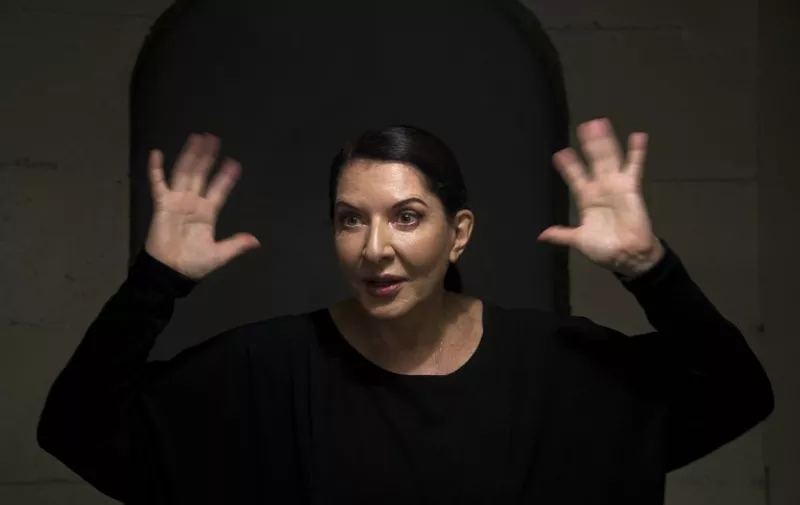 Serbian-born performance artist Marina Abramovic gestures during an interview with AFP in Sao Paulo, Brazil on April 8, 2015. AFP PHOTO / NELSON ALMEIDA