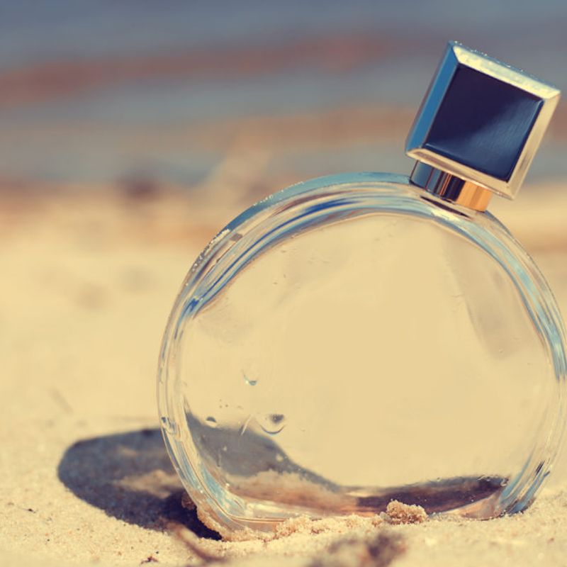 Women's perfume on the beach
