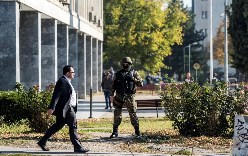 A Macedonian police officer secures the court during the trial of 37 men accused of terror charges over a shootout with police, in Skopje on November 2, 2017. Eight police officers and 10 gunmen were killed and dozens injured in the clashes, which erupted in the ethnically-mixed northern town of Kumanovo near the border with Kosovo. (Photo by Robert ATANASOVSKI / AFP)