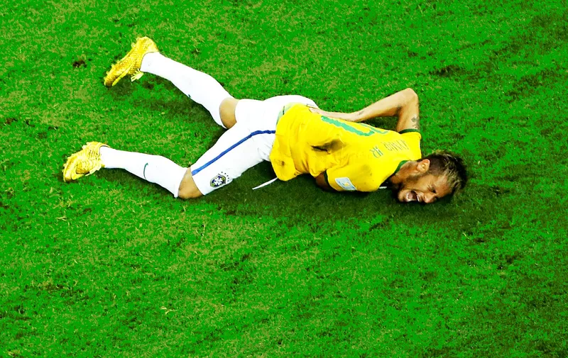 July 4, 2014 - Fortaleza, Brazil - Brazil's NEYMAR lies on the ground in pain after being fouled by J. Zuniga of Colombia during the quarterfinal match between Brazil and Colombia during their 2014 Brazil FIFA World Cup at the Castelao Stadium, in Fortaleza, Brazil, Image: 198151270, License: Rights-managed, Restrictions: , Model Release: no, Credit line: Profimedia, Zuma Press - News