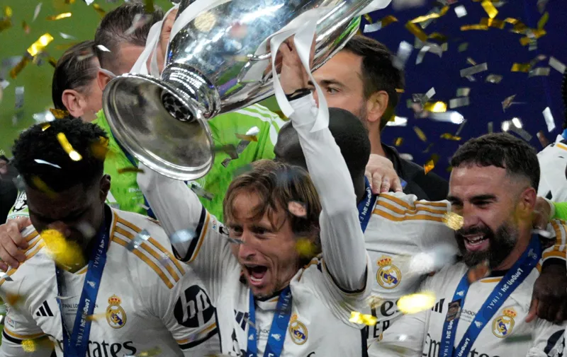 Real Madrid's Luka Modric lifts the trophy after the Champions League final soccer match between Borussia Dortmund and Real Madrid at Wembley stadium in London, Saturday, June 1, 2024. Real Madrid won 2-0. (AP Photo/Dave Shopland)