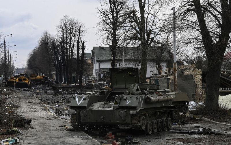 This general view shows destroyed Russian armored vehicles in the city of Bucha, west of Kyiv, on March 4, 2022. - The UN Human Rights Council on March 4, 2022, overwhelmingly voted to create a top-level investigation into violations committed following Russia's invasion of Ukraine. More than 1.2 million people have fled Ukraine into neighbouring countries since Russia launched its full-scale invasion on February 24, United Nations figures showed on March 4, 2022. (Photo by ARIS MESSINIS / AFP)
