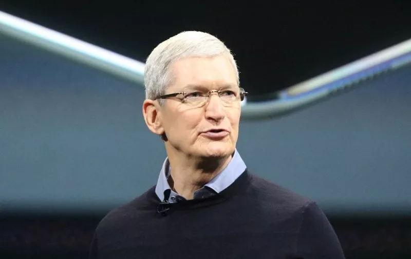 Apple CEO Tim Cook presents the smaller iPhone SE during the spring event at its headquarters in Cupertino, California, USA, 21 March 2016. The device resembles the iPhone 5 but includes features of some newer and larger models of the iPhone 6 series, such as a faster CPU, a 12-megapixel camera and an NFC chip that may be used by mobile payment systems among others. Photo: CHRISTOPH DERNBACH/dpa - NO WIRE SERVICE -