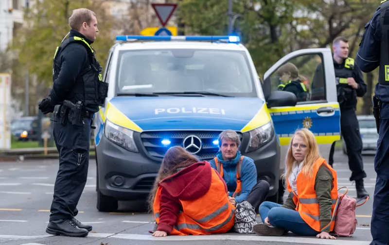Climate activists from the LAST GENERATION UPRISING are blocking road traffic at the intersection of Bornholmer Straße and Schönhauser Allee in Berlin-Prenzlauer Berg. Some players have stuck themselves to the streets. They call for an immediate phase-out of fossil fuels, speed 100 on motorways and the introduction of the 9-euro ticket for local transport./ Climate activists from LAST GENERATION UPRISING block traffic at the intersection of Bornholmer Strasse and Schönhauser Allee in Berlin-Prenzlauer Berg. Some actisites have glued themselves to the street. They demand an immediate phase-out of fossil fuels, a speed limit of 100 km/h on freeways and the introduction of the 9-euro ticket for local transport.
Climate Activists Block Streets in Berlin again, berlin, berlin, germany - 07 Nov 2022,Image: 735766108, License: Rights-managed, Restrictions: , Model Release: no