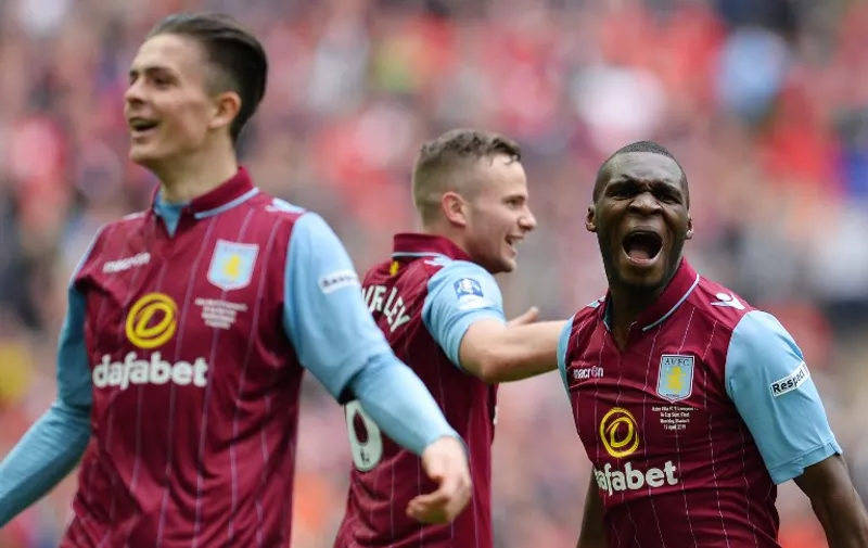 Aston Villa&#8217;s Zaire-born Belgian striker Christian Benteke (R) celebrates Villa&#8217;s second goal during the FA Cup semi-final between Aston Villa and Liverpool at Wembley stadium in London on April 19, 2015. AFP PHOTO / GLYN KIRK NOT FOR MARKETING OR ADVERTISING USE / RESTRICTED TO EDITORIAL USE