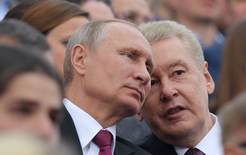 MOSCOW, RUSSIA - SEPTEMBER 9, 2017: Moscow Mayor Sergei Sobyanin (R) and Russia's President Vladimir Putin watch a concert marking the 870th birthday of Moscow, in Red Square. Alexei Druzhinin/Russian Presidential Press and Information Office/TASS,Image: 349039884, License: Rights-managed, Restrictions: , Model Release: no
