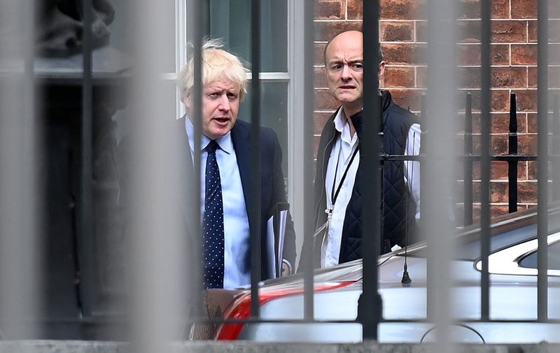 (FILES) In this file photo taken on September 03, 2019 Britain's Prime Minister Boris Johnson (L) and his special advisor Dominic Cummings leave from the rear of Downing Street in central London, before heading to the Houses of Parliament. - Preparedness in Britain for a no-deal Brexit remains "at a low level", with logjams at Channel ports threatening to impact drug and food supplies, according to government assessments released September 11, 2019. British MPs voted last week to force the government to publish the no-deal "Operation Yellowhammer" document, which also warns of "public disorder" in such a scenario. Britain's plan for no checks at the Irish border would likely "prove unsustainable due to significant economic, legal and biosecurity risks", it said, adding that it could lead to a black market developing in border communities, with dissident groups expected to capitalise. (Photo by DANIEL LEAL-OLIVAS / AFP)