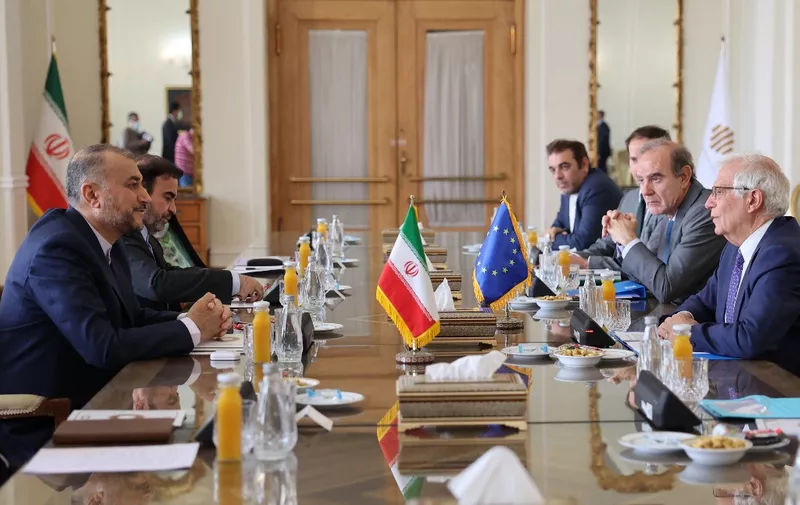 Iran's Foreign Minister Hossein Amir-Abdollahian (L) meets Josep Borell, the High Representative of the European Union for Foreign Affairs and Security Policy (R), and Deputy Secretary General of the European External Action Service (EEAS) Enrique Mora (2nd-R) at the foreign ministry headquarters in Iran's capital Tehran on June 25, 2022. - European Union foreign policy chief Josep Borrell met Iran's top diplomat today after arriving for talks on efforts to revive the 2015 Iran nuclear deal. Borrell flew in to Tehran on Friday night for a surprise visit aimed at getting the talks back on track three months after they stalled in March amid differences between Iran and the United States. (Photo by ATTA KENARE / AFP)