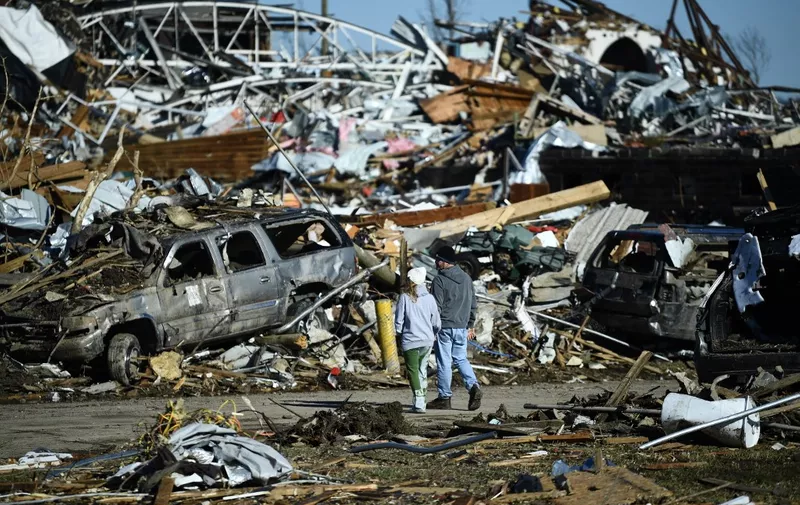 Tornado damage is seen after extreme weather hit the region December 12, 2021, in Mayfield, Kentucky. - Dozens of devastating tornadoes roared through five US states overnight, leaving more than 80 people dead Saturday in what President Joe Biden said was "one of the largest" storm outbreaks in history. (Photo by Brendan Smialowski / AFP)