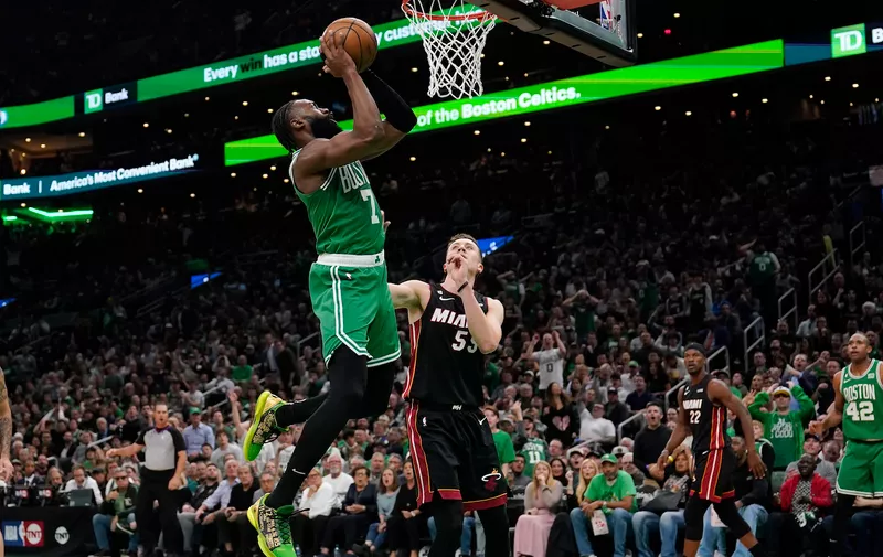 Boston Celtics guard Jaylen Brown (7) shoots as Miami Heat forward Duncan Robinson defends during the first half in Game 5 of the NBA basketball Eastern Conference finals Thursday, May 25, 2023, in Boston. (AP Photo/Charles Krupa )