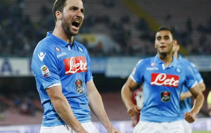 Napoli's forward from Argentina and France Gonzalo Higuain celebrates after scoring during the Italian Serie A football match SSC Napoli vs AC Milan on May 3, 2015 at the San Paolo stadium in Naples. AFP PHOTO / CARLO HERMANN