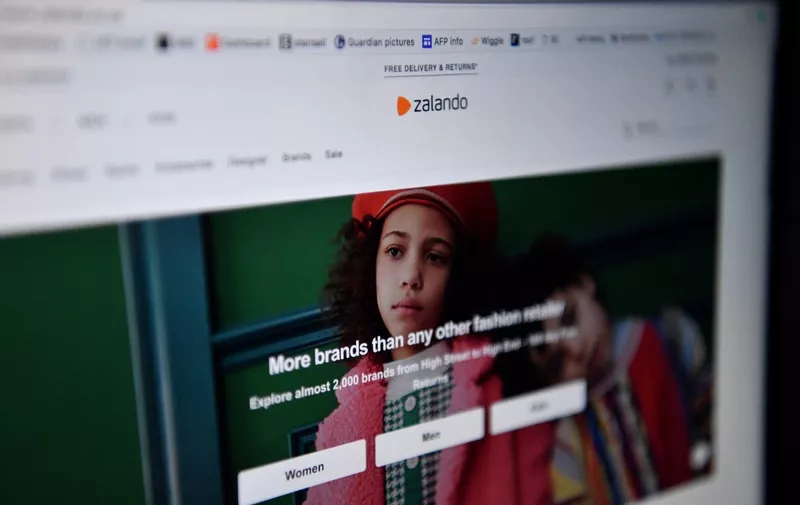 The online fashion portal Zalando is pictured on a laptop on April 30, 2020 in London. - Farewell suits and high heels and welcome jogging trousers and slippers as consumers adopt a more relaxed approach to fashion during lockdown. (Photo by Ben STANSALL / AFP)