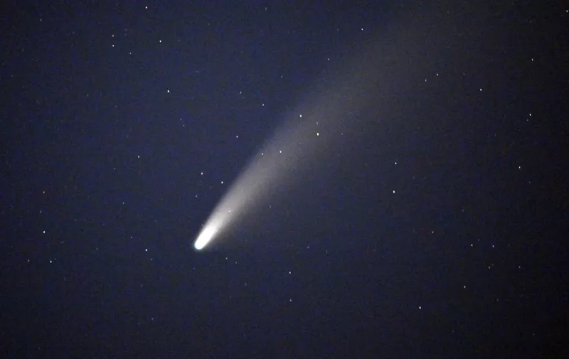 Comet NEOWISE or C/2020 F3 is seen in the sky in Jean, Nevada on July 15, 2020. The comet was discovered March 27, 2020, by NEOWISE, the Near Earth Object Wide-field Infrared Survey Explorer, which is a space telescope launched by NASA in 2009. (Photo by David Becker / AFP)